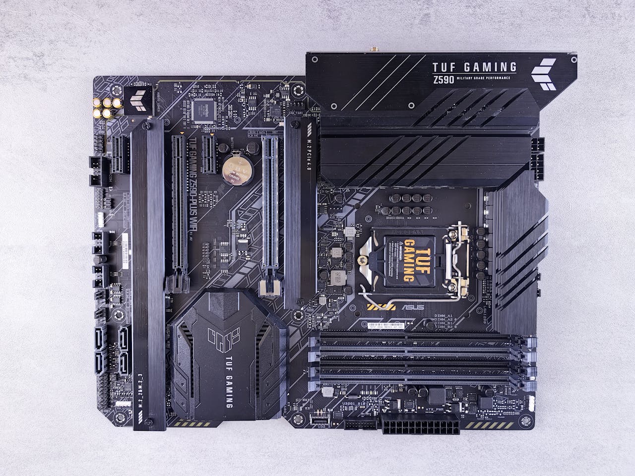 High-quality image of ASUS TUF Gaming Z590 motherboard showcasing intricate electronic details.